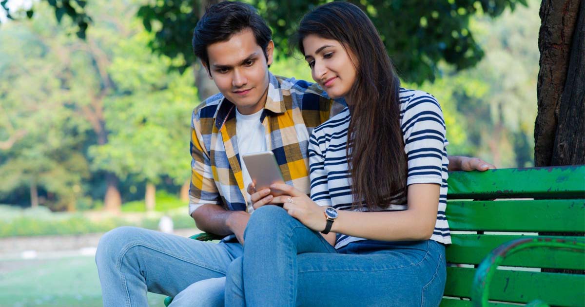 Friends sitting on park