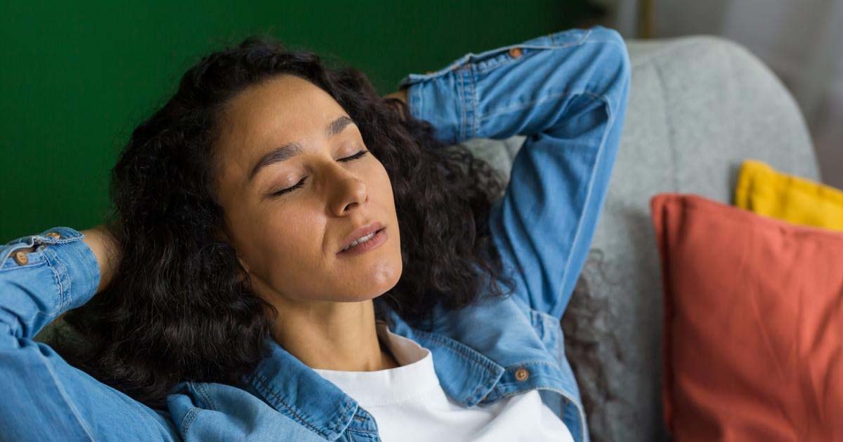 Woman Sitting on Sofa