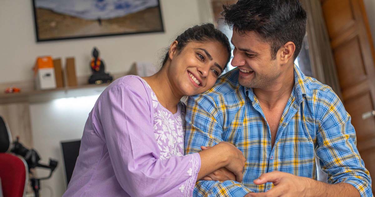 couple talking while sitting at home