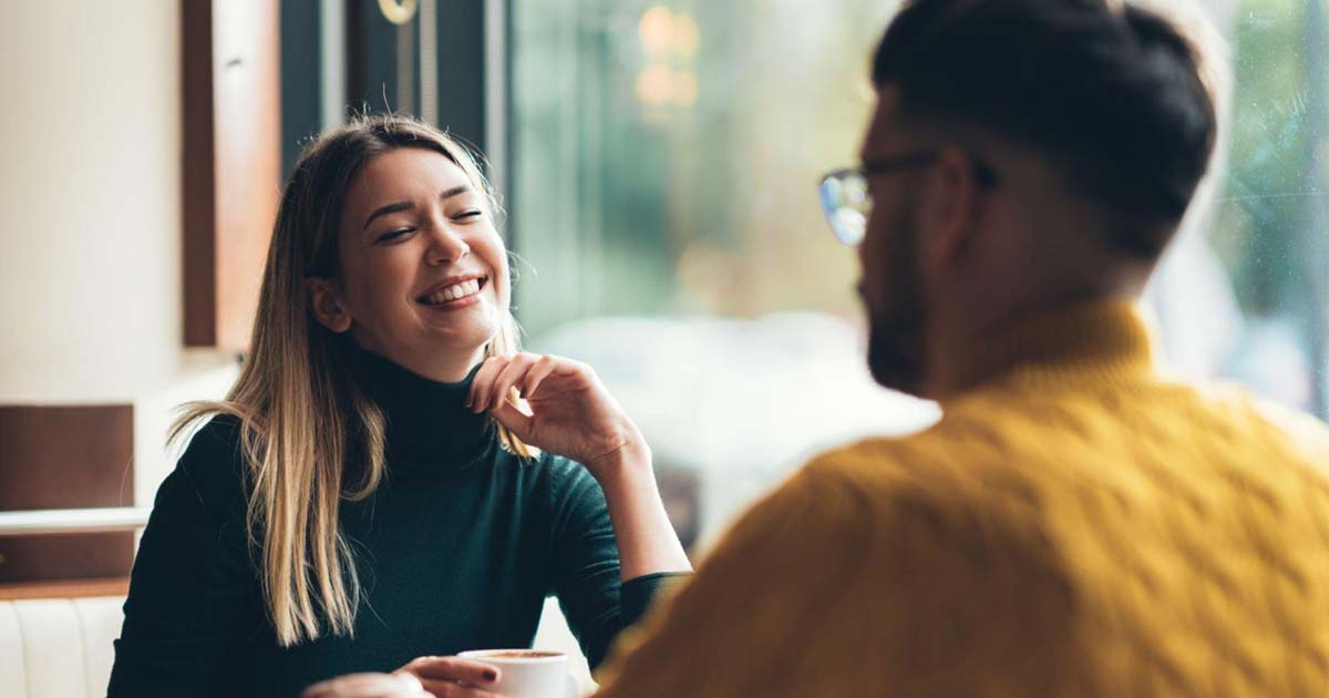 Beautiful young couple sitting in a cafe