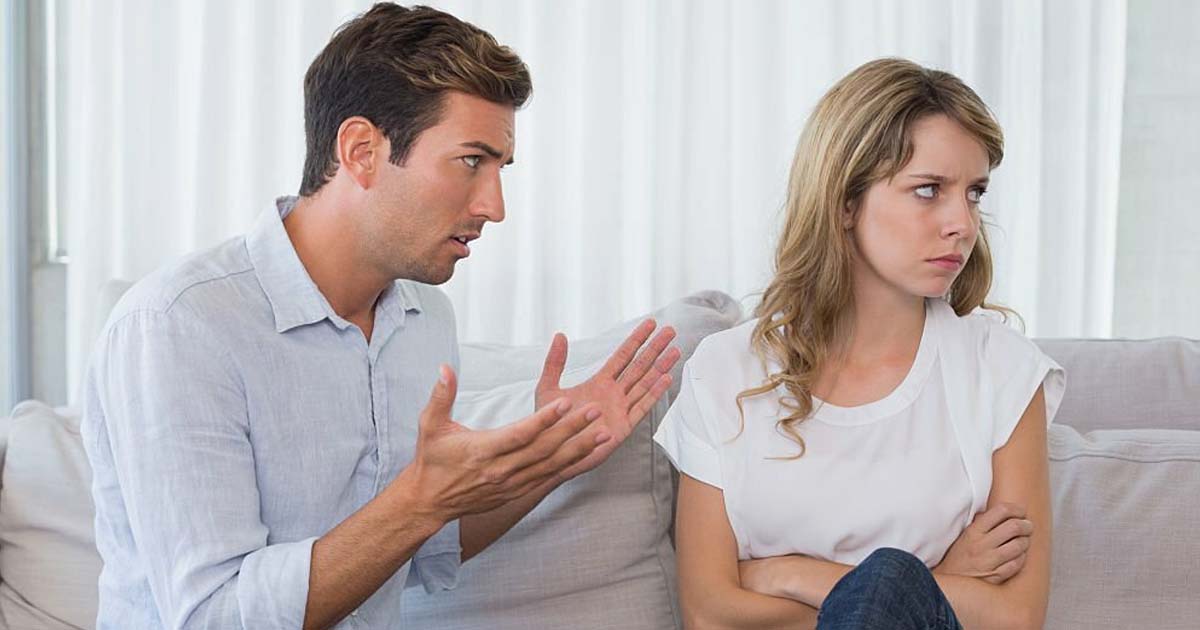 Couple having an argument in living room