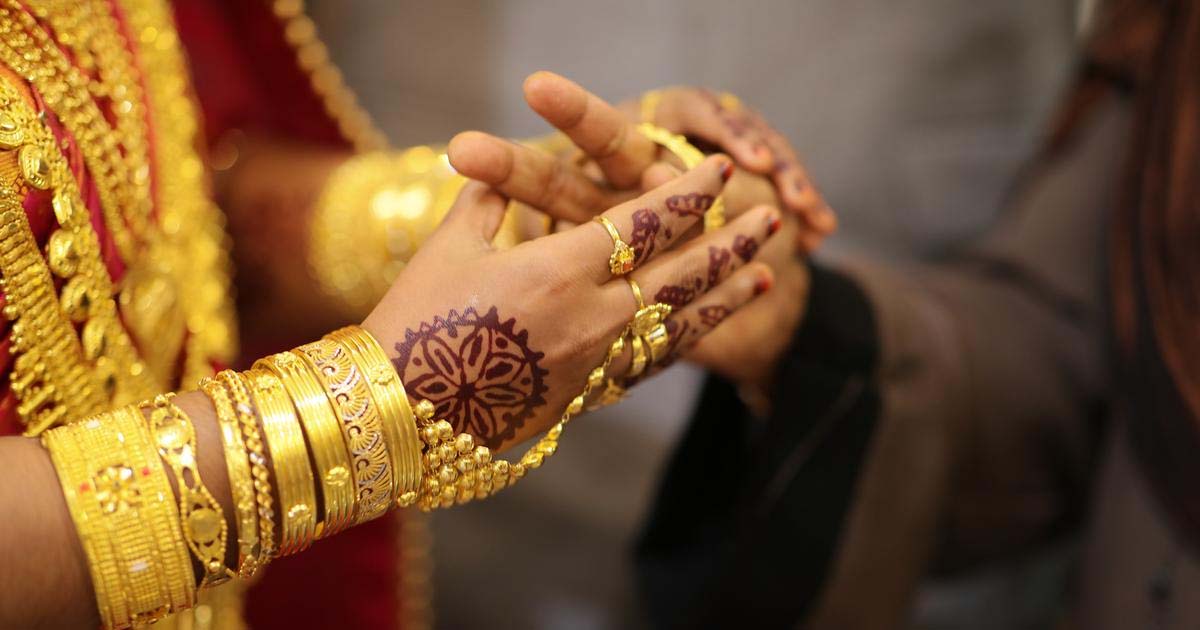 Indian woman with gold jewelry