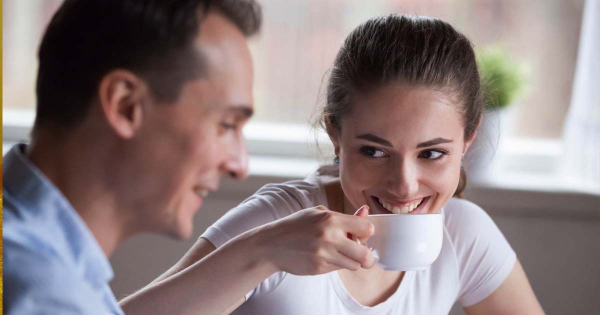 Smiling woman drinking coffee