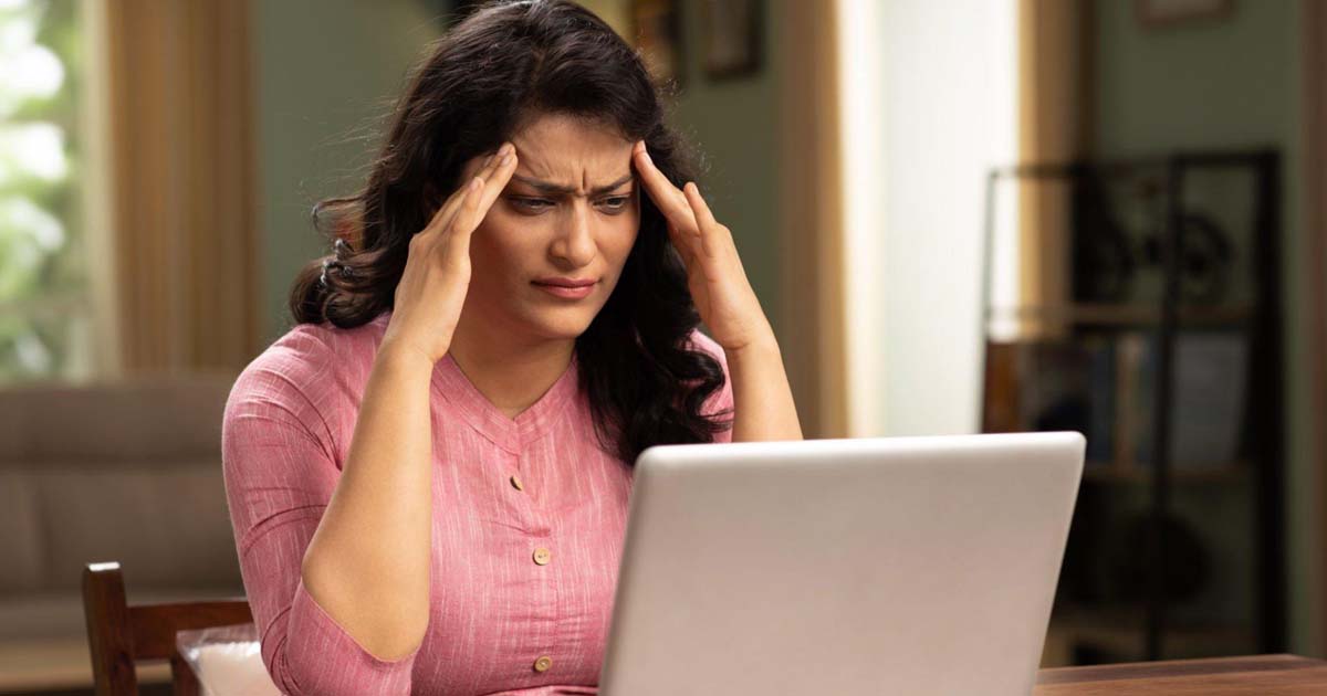 Woman using laptop at home