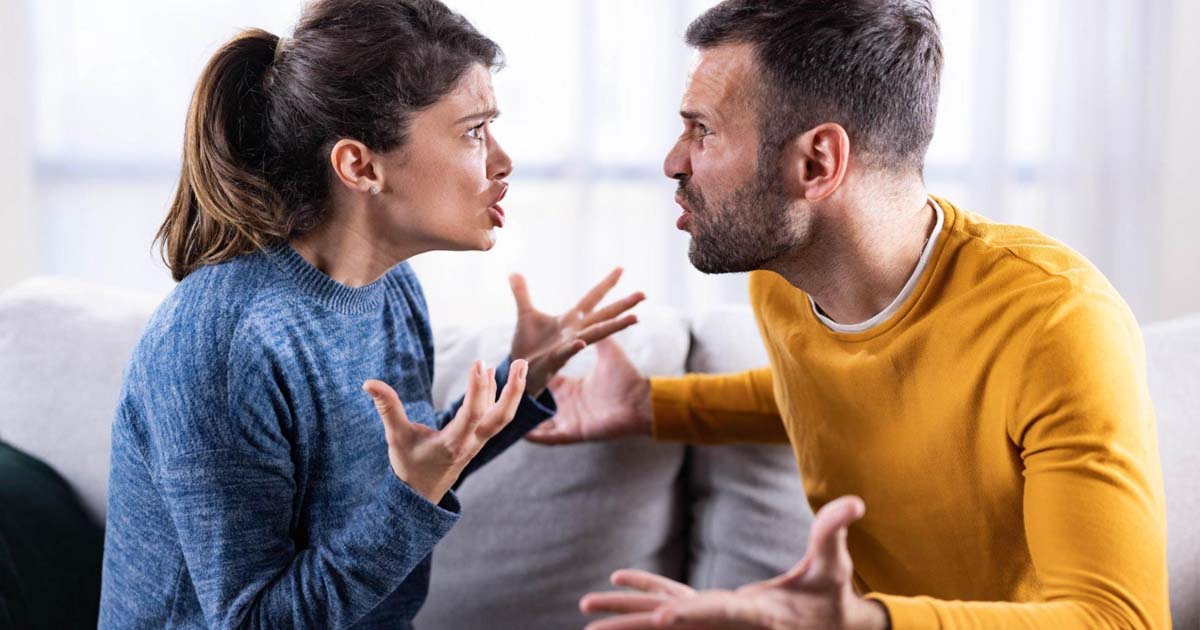 couple arguing on sofa