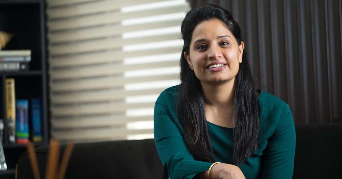 happy woman sitting on sofa